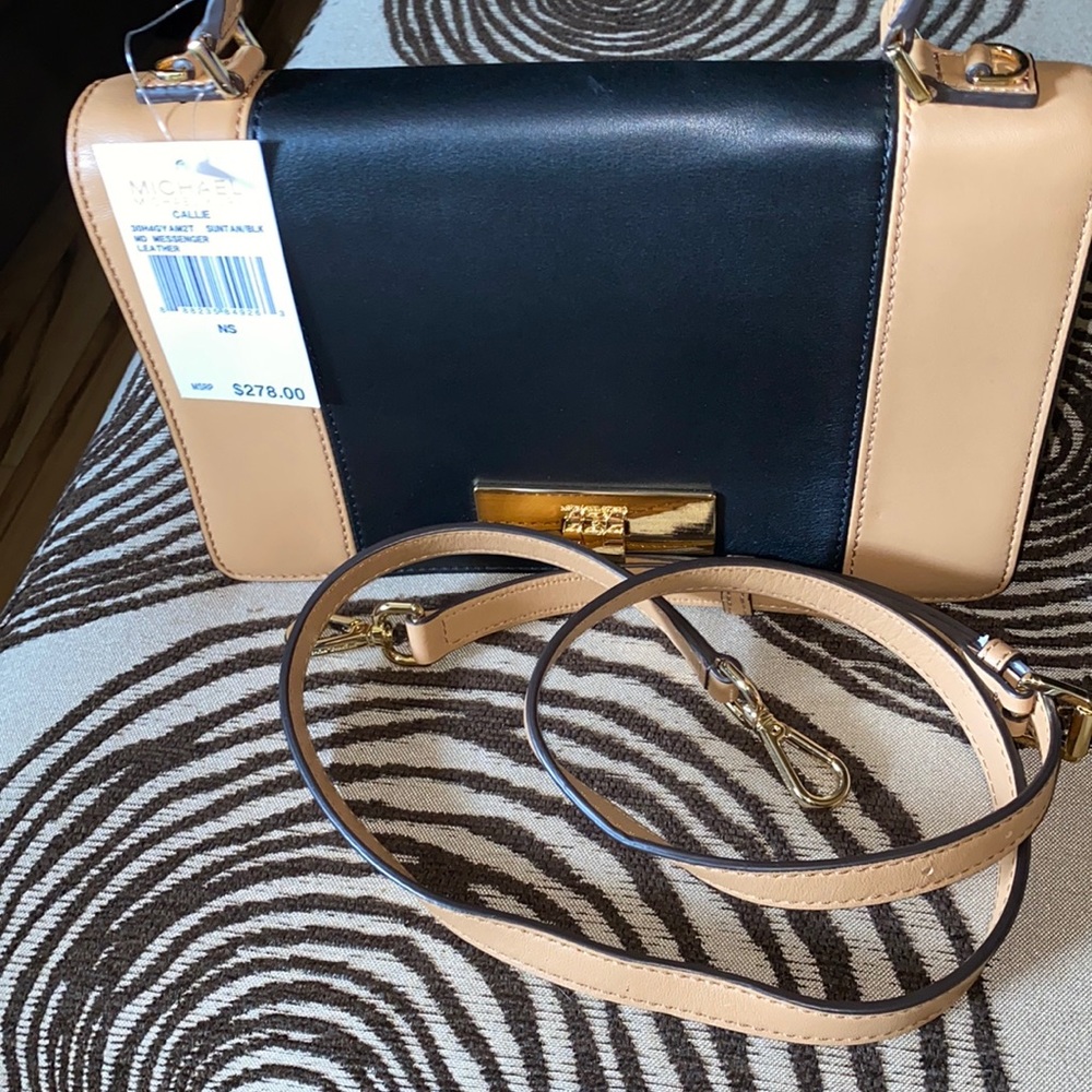 Michael Kors medium messenger bag. New with tags
